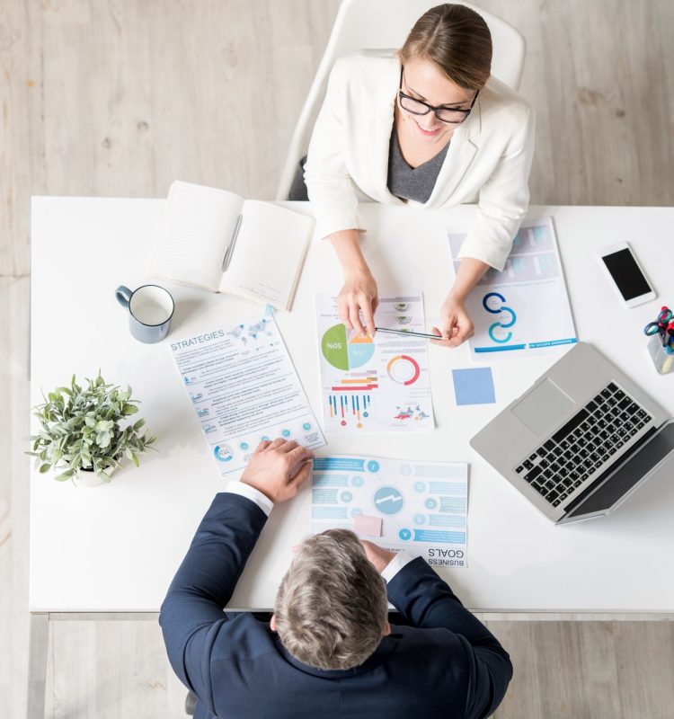 analytical-expert-explaining-statistics-to-businessman.jpg